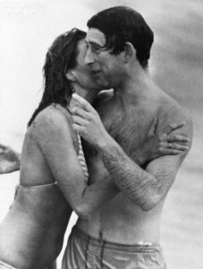 10 Mar 1979, Perth, Australia --- Prince Charles is kissed by Jane Priest, a model, as he emerges from the water at Cottesloe beach in Perth, during his 1979 tour of Australia. --- Image by © Hulton-Deutsch Collection/CORBIS